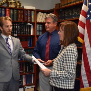 Prosecutor Schiffel swears in a new Assistant Prosecutor.